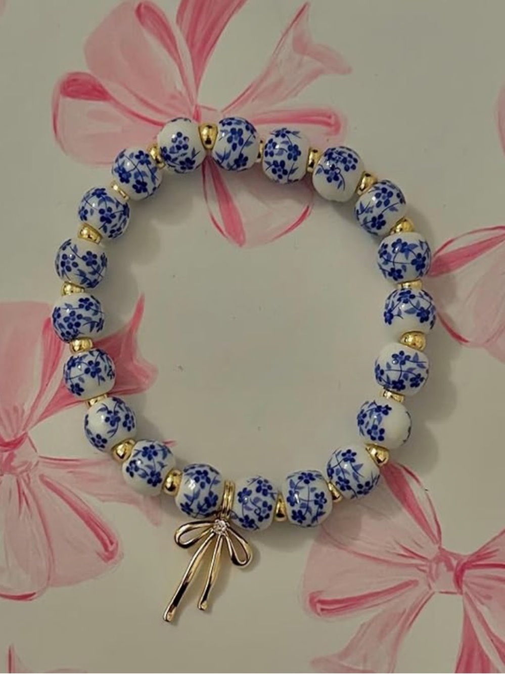 New Anthropologie Blue and White Floral Bead Bracelet with Gold Bow Charm